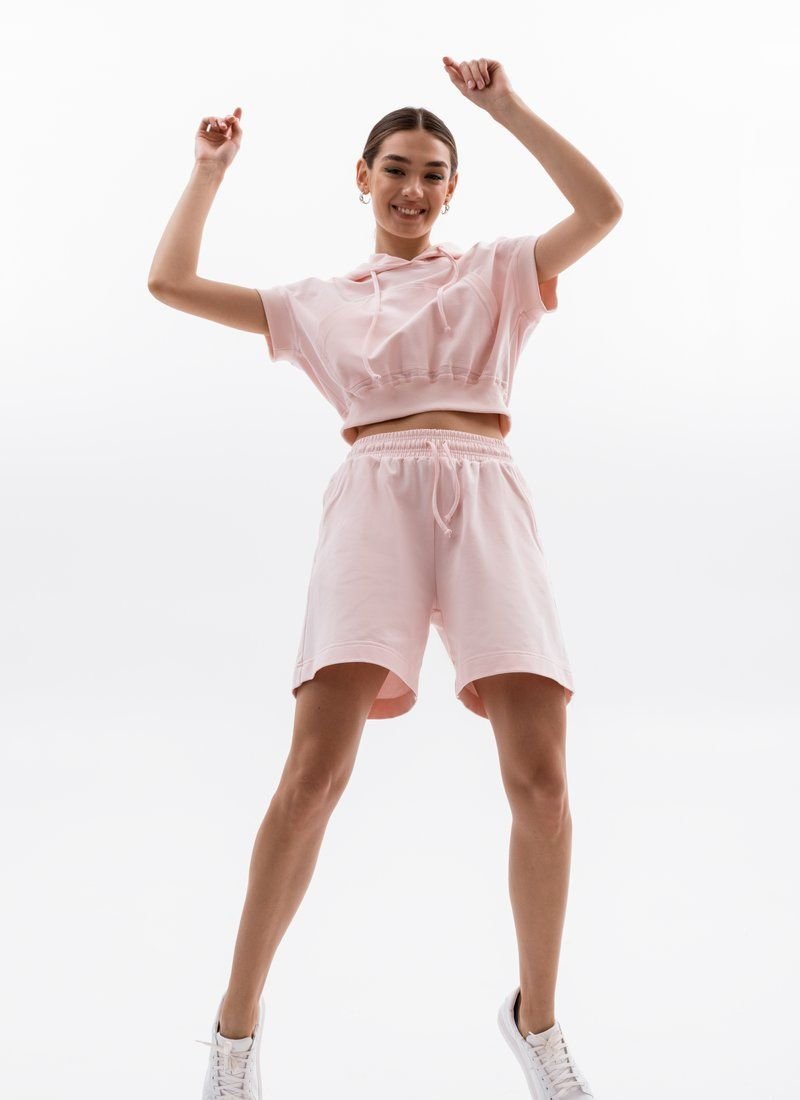 A soft pink tracksuit