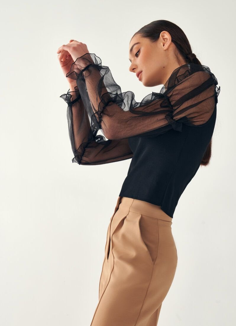 Jumper with translucent sleeves