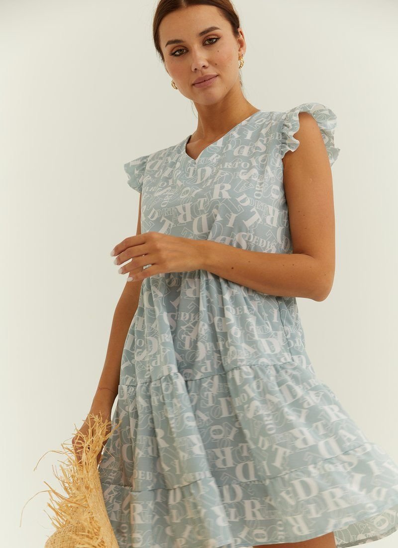 A short mint-colored dress