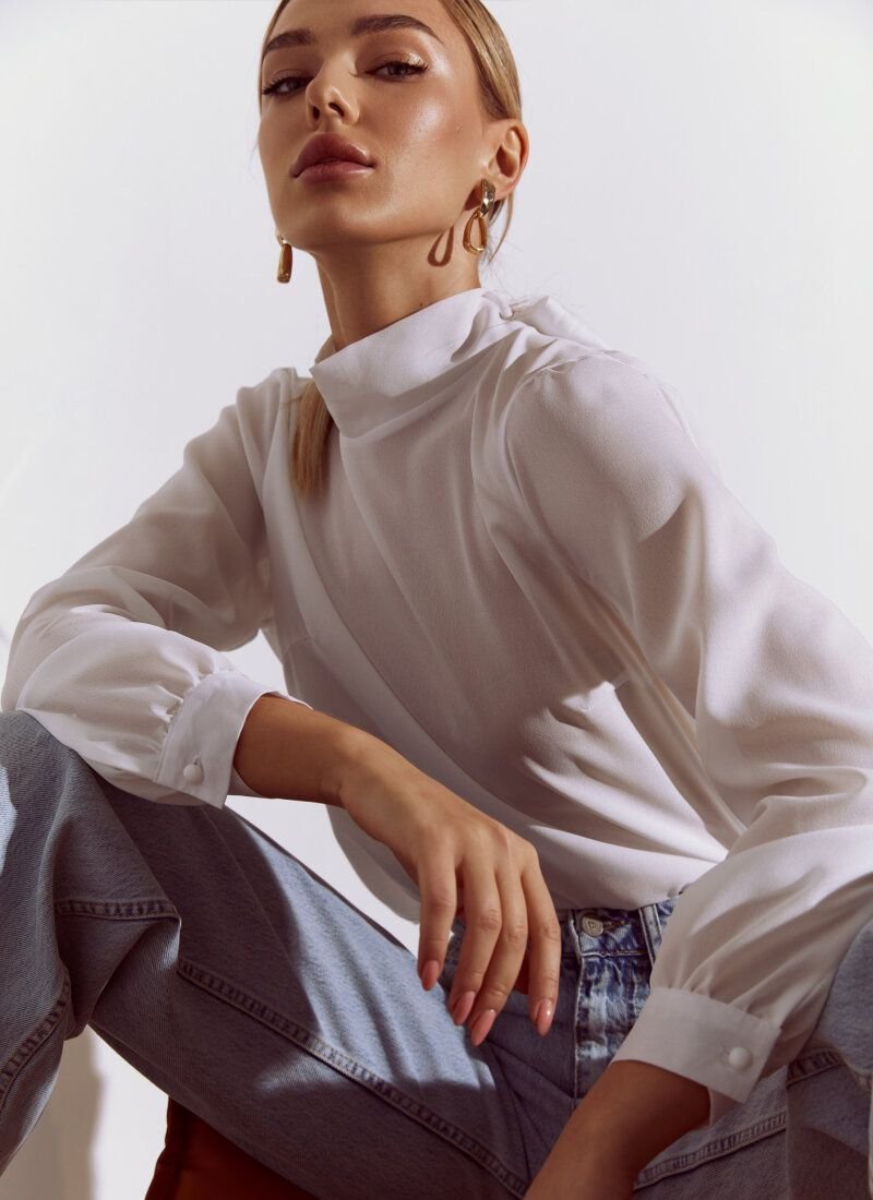 White blouse with a laconic cut