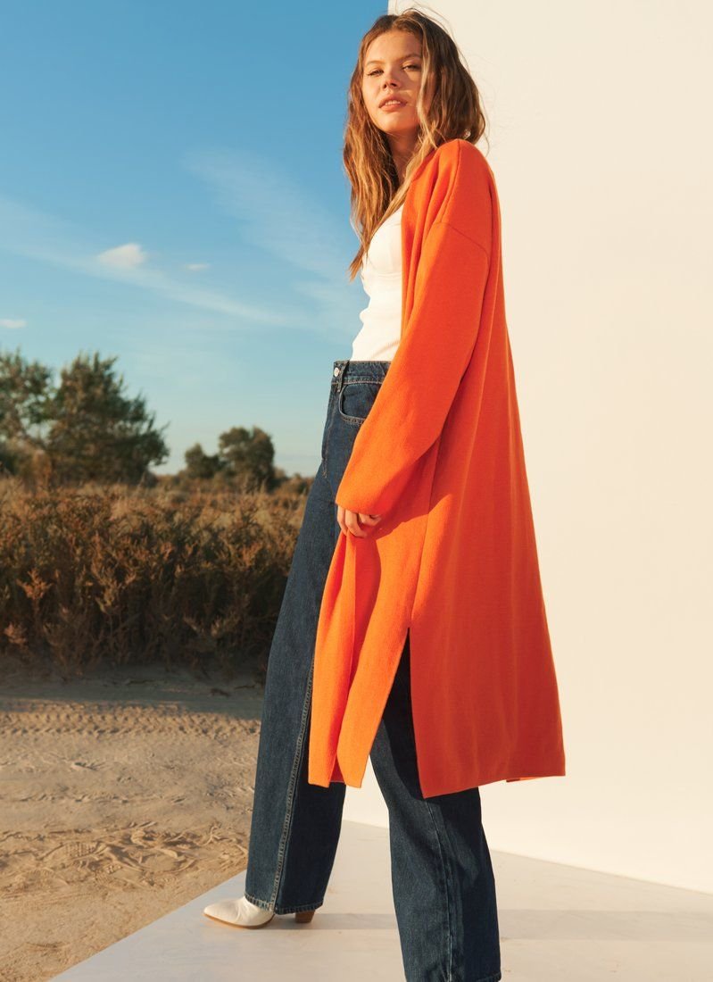 Bright orange cardigan