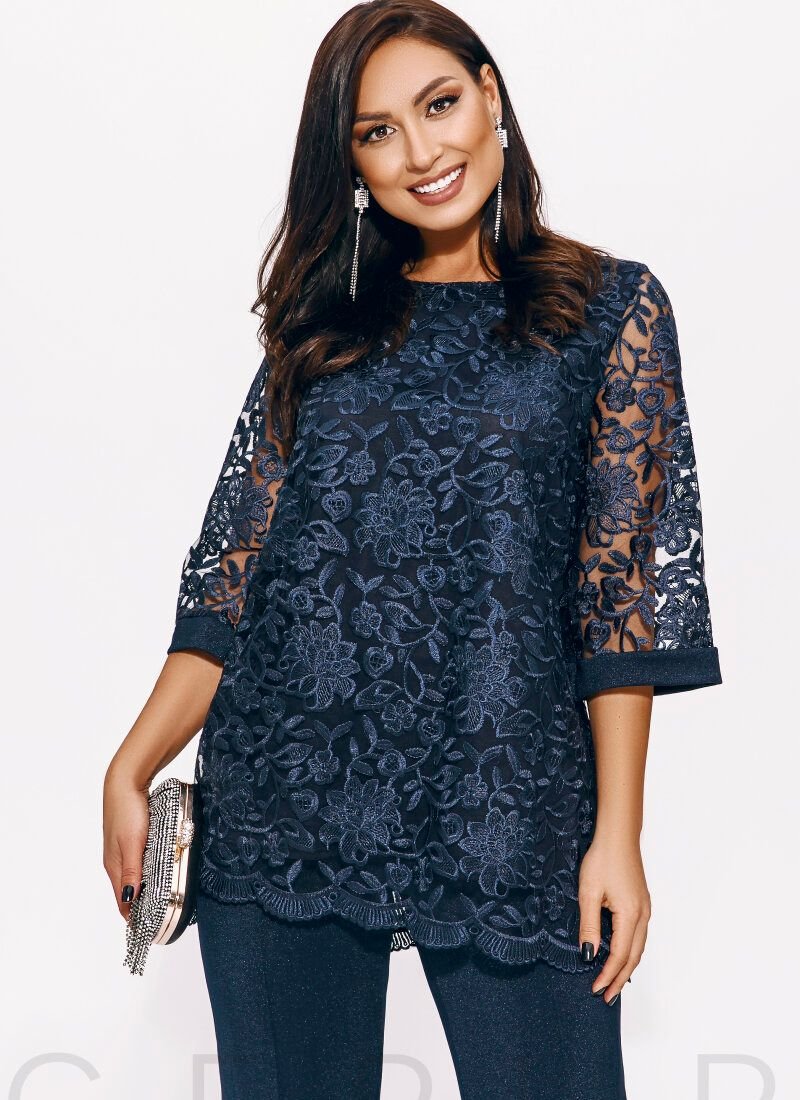 A suit with a lace blouse