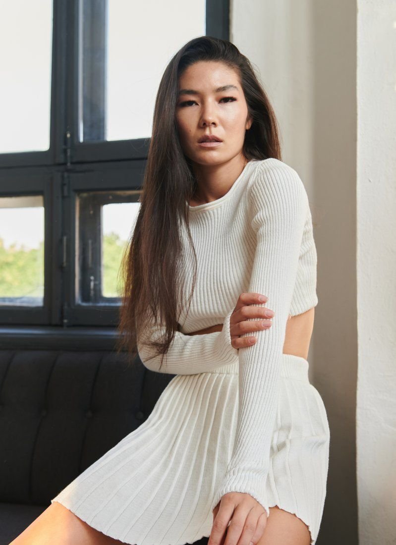 Knitted suit with a short skirt