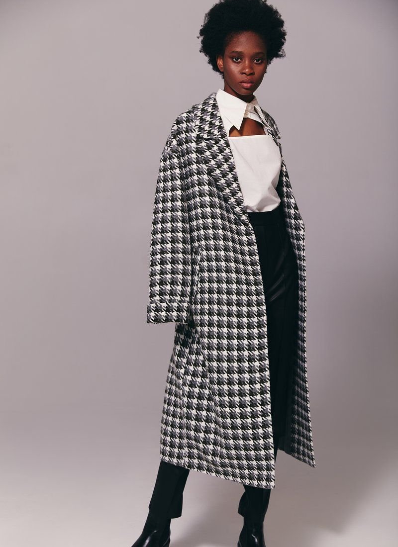 A green coat with a goose's foot