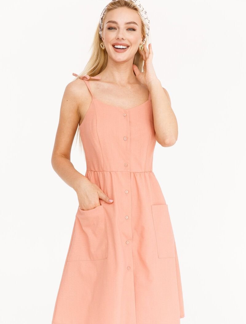 A sundress of a delicate powdery shade