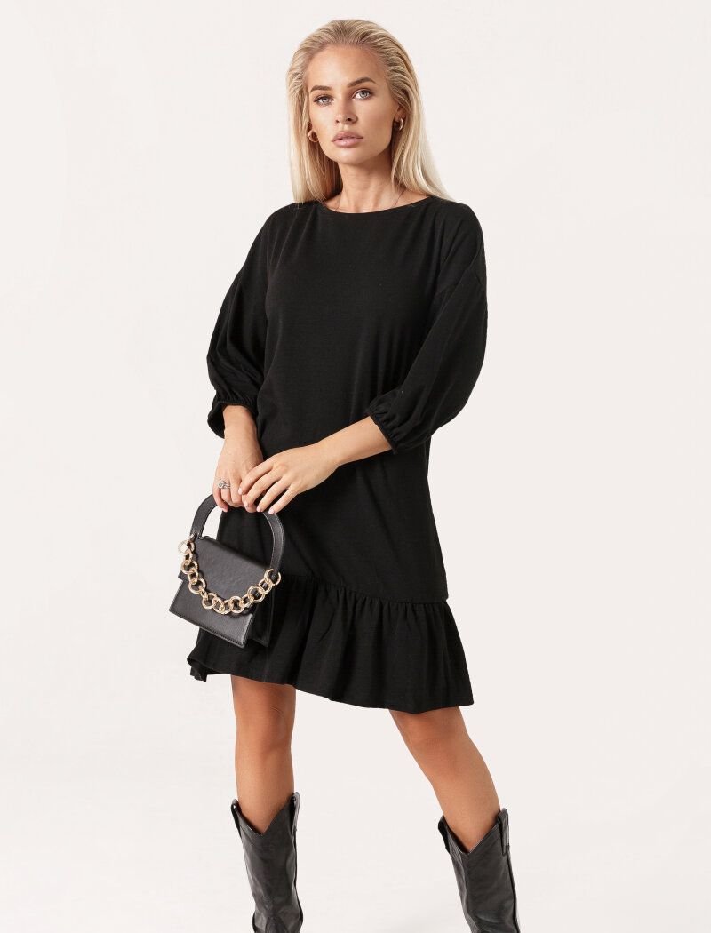 Romantic black dress with a flounce