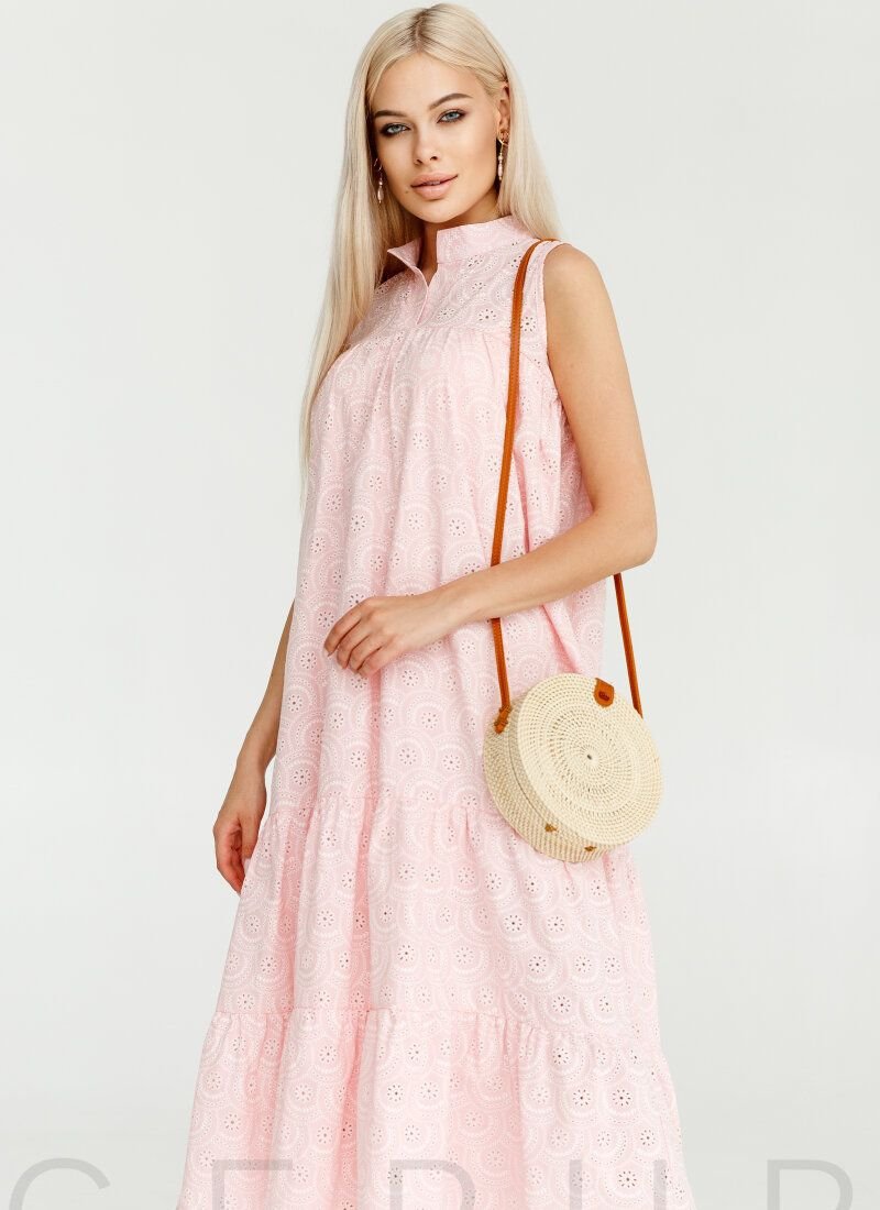 A dress of soft pink color with a loose cut