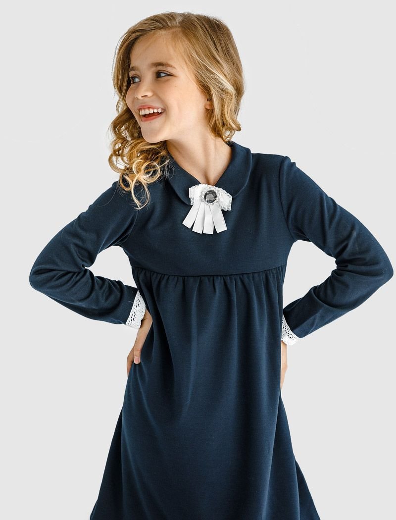 School dress with a brooch