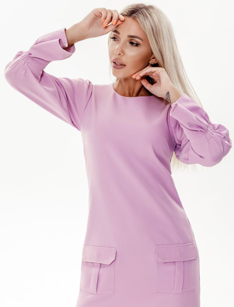 The dress is a soft lavender shade