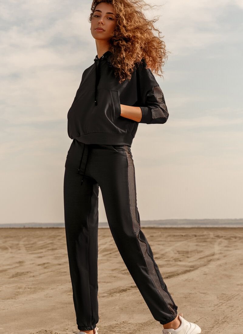 Black suit with decorative inserts