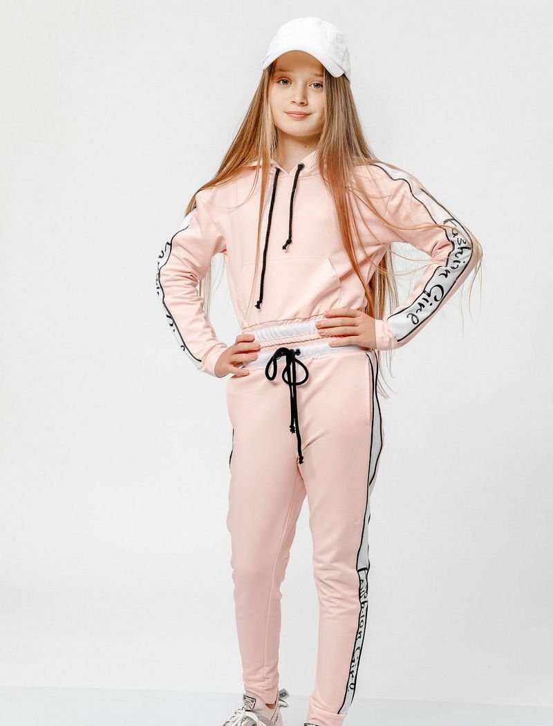 Knitted suit of a powdery shade