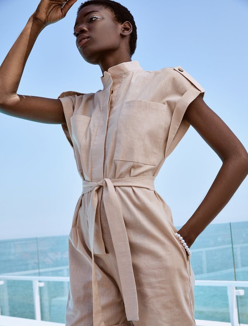 Short beige jumpsuit