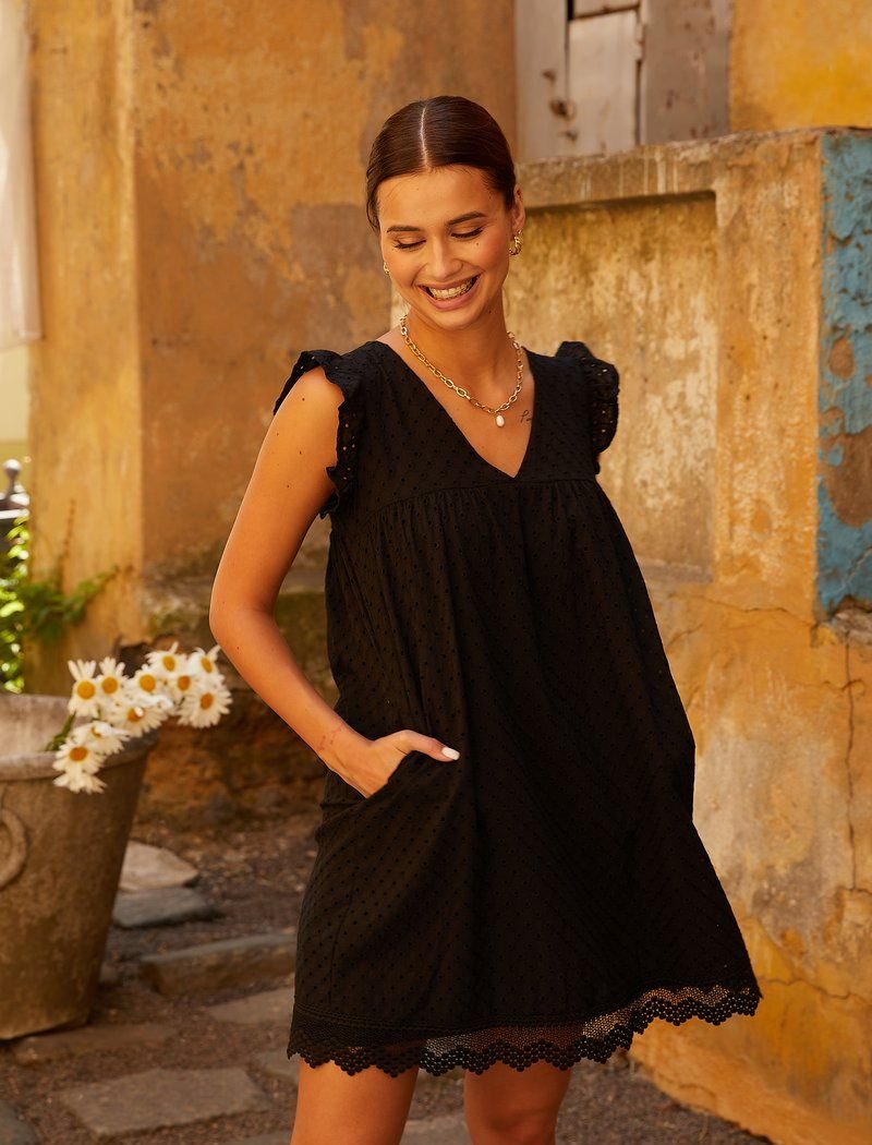 Black dress made of stitches