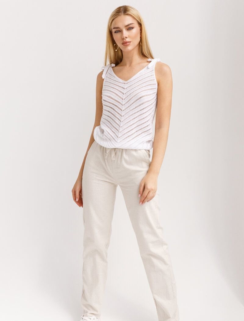 Beige linen trousers with a loose fit