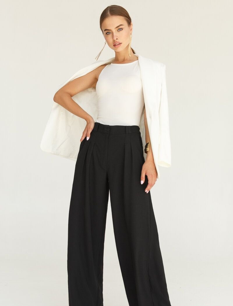 Black trousers with a loose fit