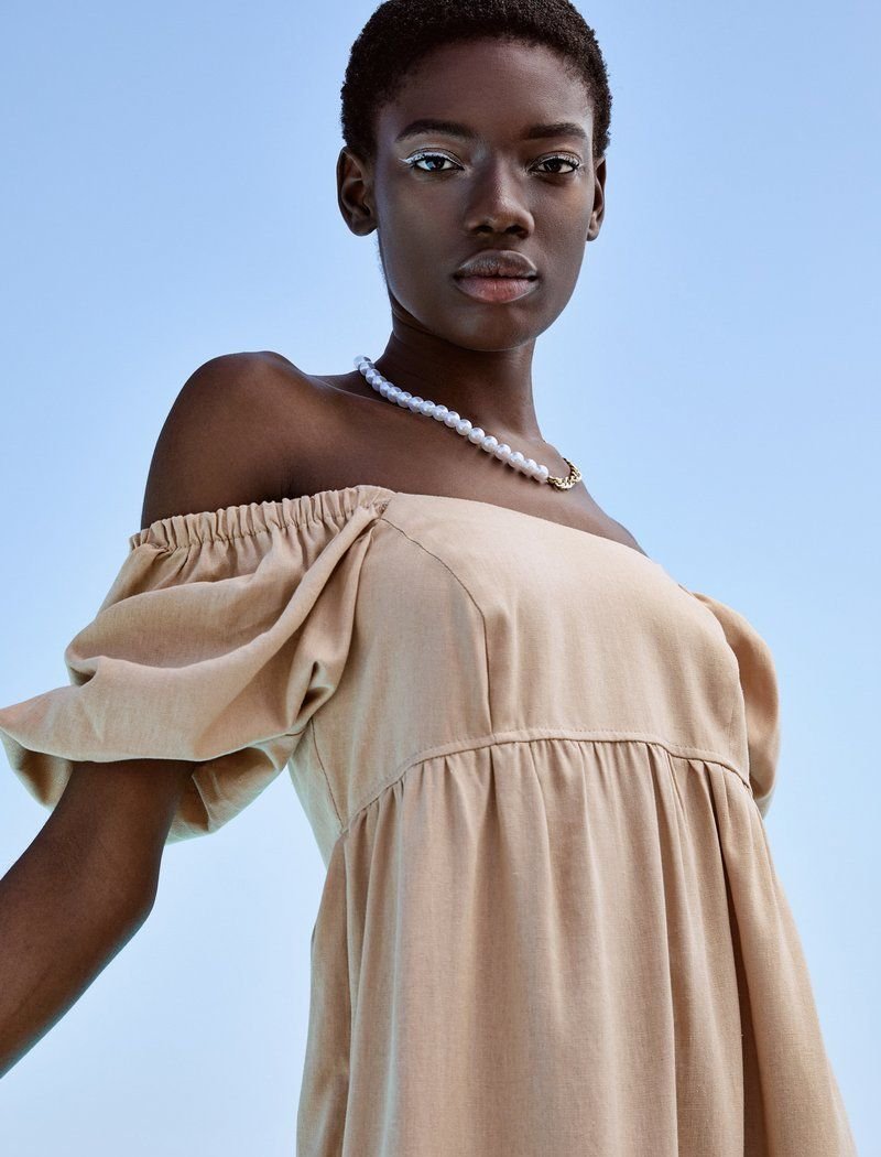 Beige dress made of soft fabric