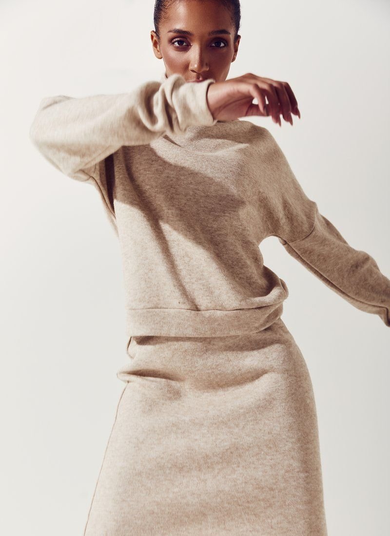 Beige knitted suit with skirt