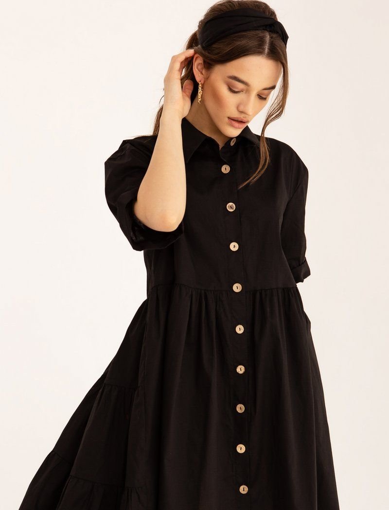 Black dress with a shirt cut