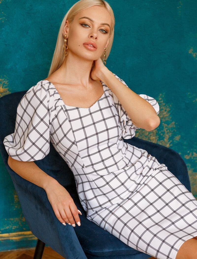 Sheath dress in an actual cage